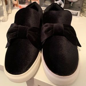 Black velvet slip ons.